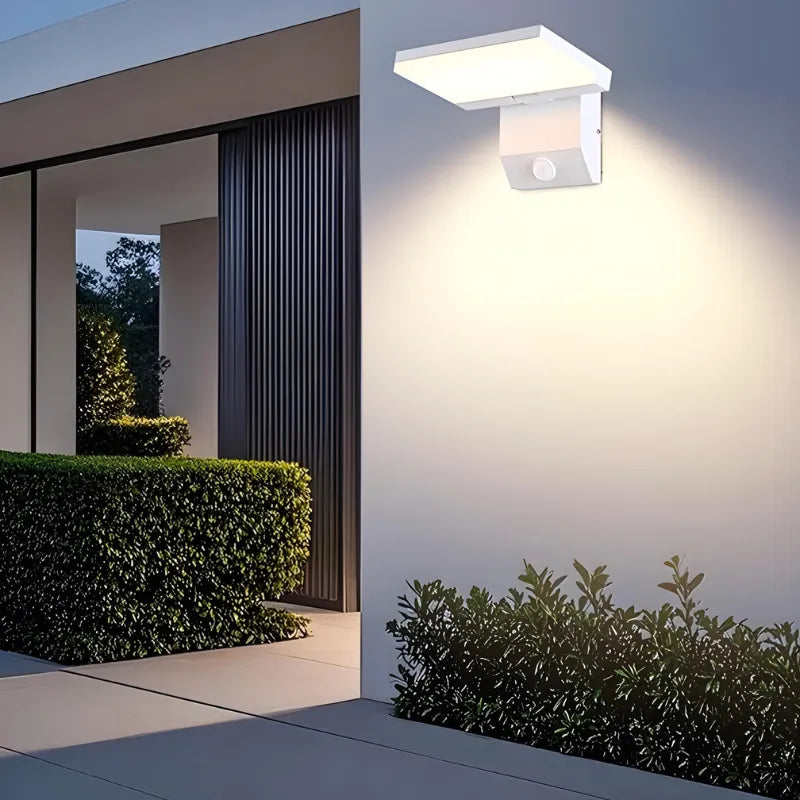 Applique murale LED extérieure moderne et minimaliste de Luminaire Essenza avec détecteur de mouvement, finition noire ou blanche.